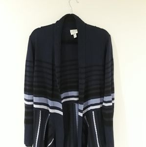 Like new. Knit cardigan with handkerchief hem.